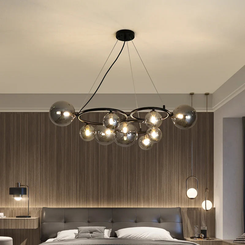 Lampadario moderno in vetro trasparente con cavo metallico regolabile