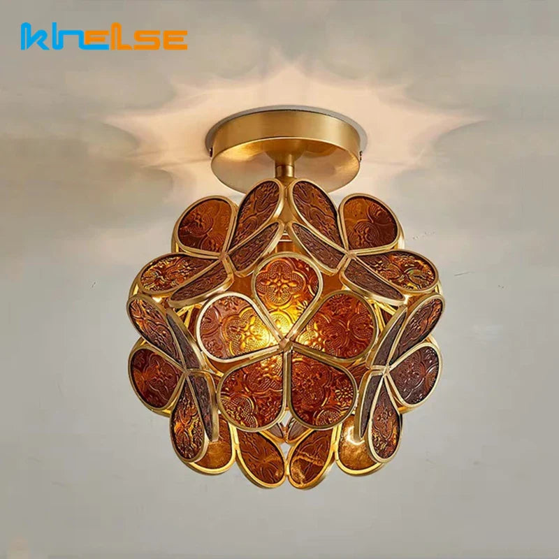 Lampadario vintage in vetro ramato luminoso