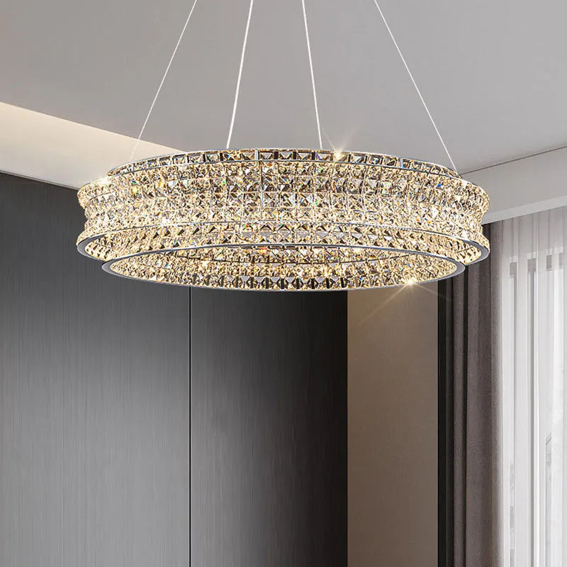 lampadario moderno in cristallo chiaro acciaio inox intensità variabile cavo regolabile